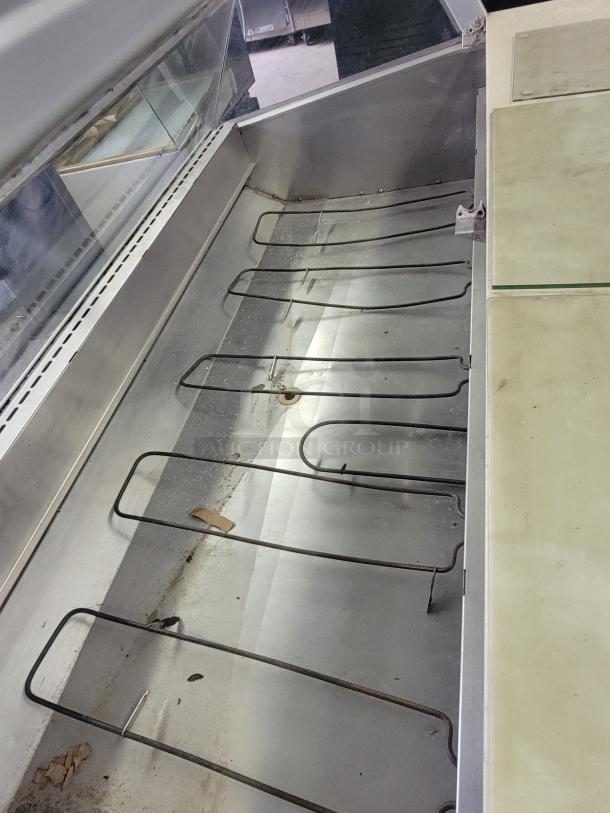 Federal SGRHD hot food display case, metal interior, glass front, for delis. Used condition, visible racks and dirt.