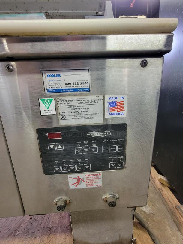 Federal SGRHD hot food display case, silver, with control panel and condition stickers, ideal for delis or bakeries. Made in USA.