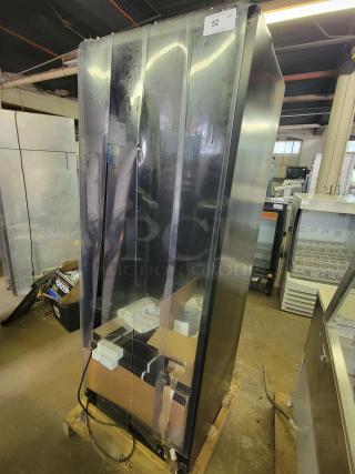 True Refrigeration CVM-27-HC vertical display cooler, new with minor cosmetic dents, ideal for showcasing chilled products.