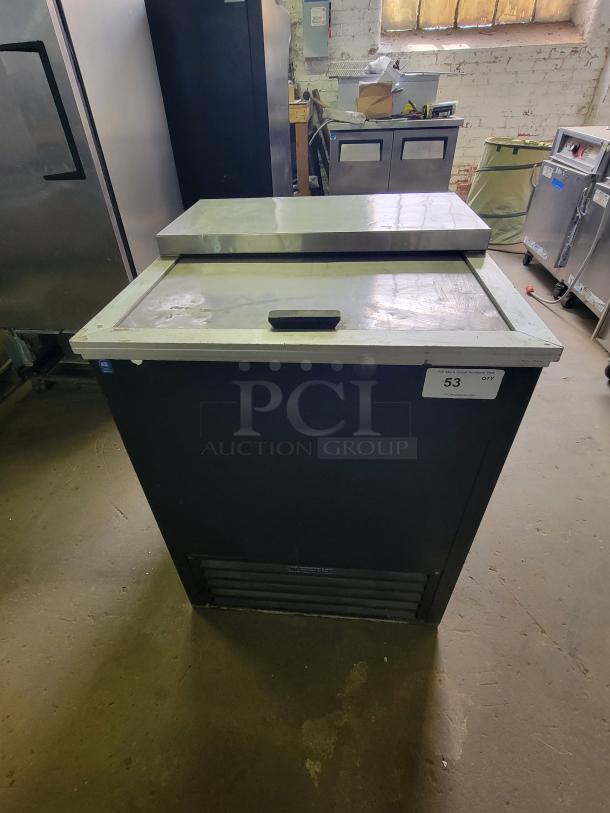 Stajac HBC-25 ice cream dipping cabinet, black exterior, stainless steel lid, good condition, auction tag visible.