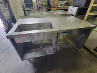 Delfield DWE-1.0 stainless steel work table with built-in hot food well, ideal for buffets. Sturdy, commercial-grade condition.