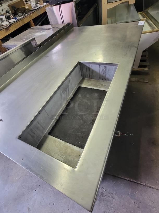 Stainless steel Delfield DWE-1.0 work table with built-in hot food well, ideal for buffets and catering. Good condition.