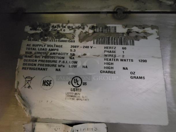 Stainless steel work table with Delfield Model DWE-1.0 hot food well. Voltage: 208-240V, 5.3A, 1200W heater. Made in USA. NSF, UL listed.