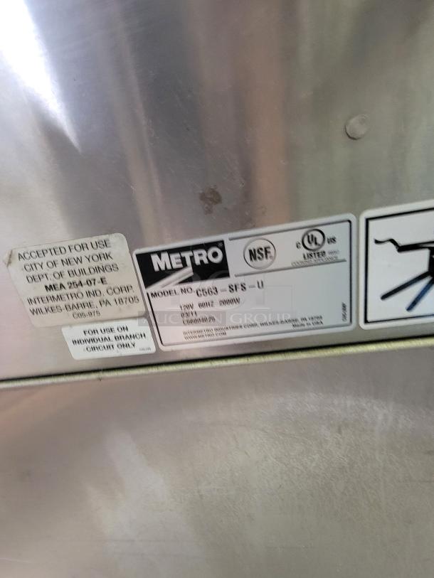 Metro Mobile Heated Holding Cabinet, model C563-SFS-U. Features visible NSF and UL labels. Ideal for food service.