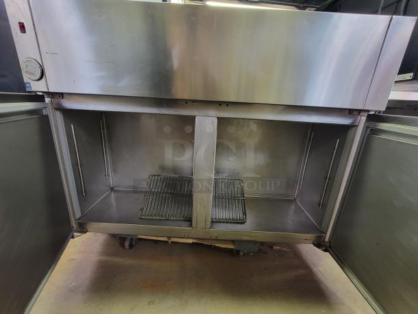 Franke 7RF02 commercial wall mount stainless steel filet freezer, open doors showing interior shelves, durable and high-capacity.