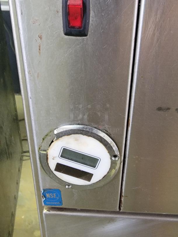 Franke Model 7RF02 commercial stainless steel wall mount filet freezer with NSF certification tag, showing wear.