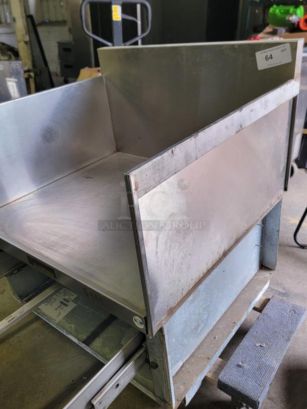 Delfield F17DD32 stainless steel equipment stand with spacious top and storage drawer, showing wear. Price noted as $999.