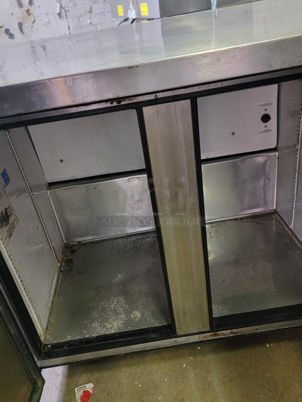 True TUC-36-34 commercial refrigerator, stainless steel, visible wear, suitable for small kitchens or food trucks.