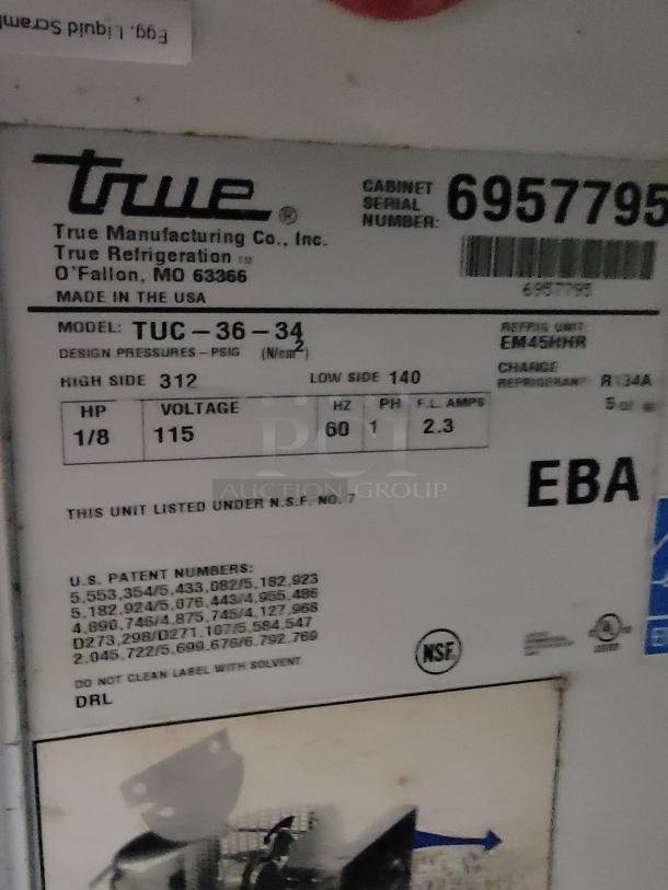 True TUC-36-34 commercial refrigerator label showing model, voltage (115), and serial number (6957795). NSF certified.