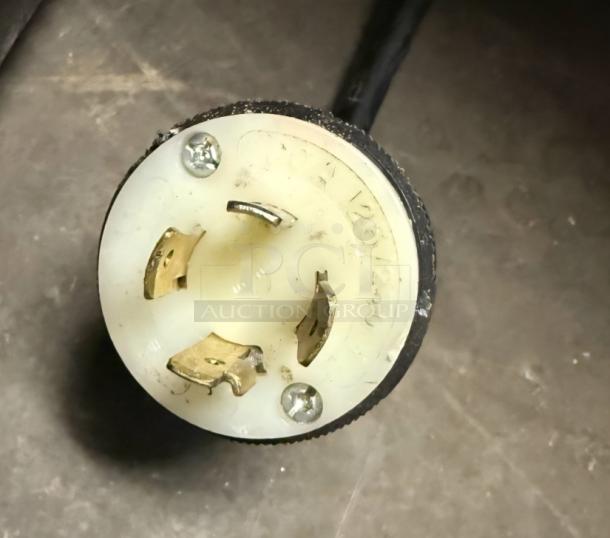 Power plug for True GDM-49F freezer, showing a 125/250V connector with visible wear; essential for setup.