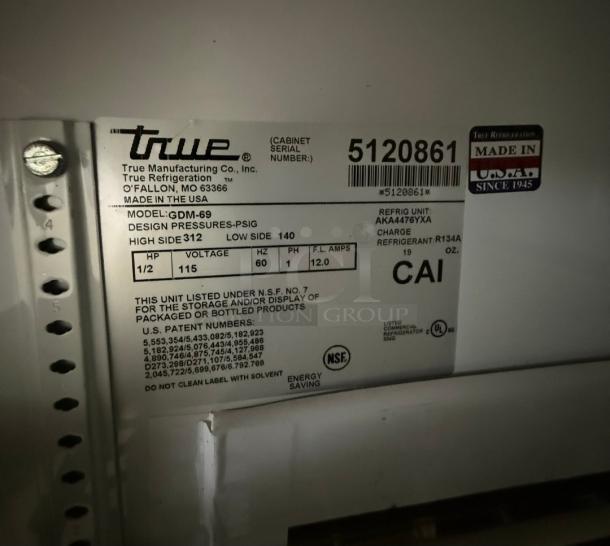 True GDM-69 Commercial Refrigerator label, displaying model, voltage, and refrigerant info. Made in the USA sticker present.