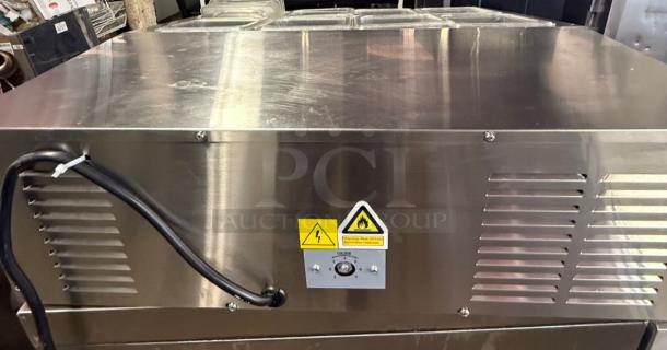 Arctic Air ACP8SQ Refrigerated Prep Rail, stainless steel, like-new condition, ideal for restaurants, warning labels visible.
