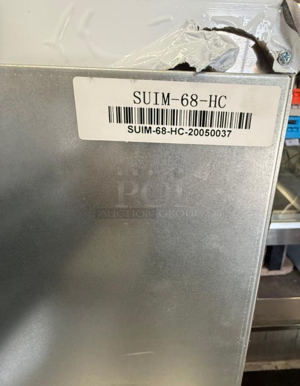 Spartan SUIM-68 ice maker with visible tag. Model SUIM-68-HC-20050037. Compact and reliable for business use.