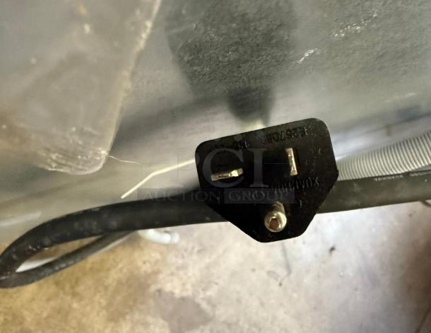 Black power plug of Fagor CO-500W dishwasher with visible markings; part of the undercounter model's connection components.