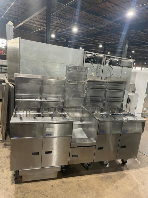 Pitco FGSGH50 commercial 4-bay fryer system, stainless steel, natural gas, with basket hangers, fry baskets, oil filter, and blue gas hose.