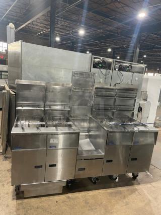 Pitco FGSGH50 commercial 4-bay fryer system, stainless steel, natural gas, with basket hangers, fry baskets, oil filter, and blue gas hose.