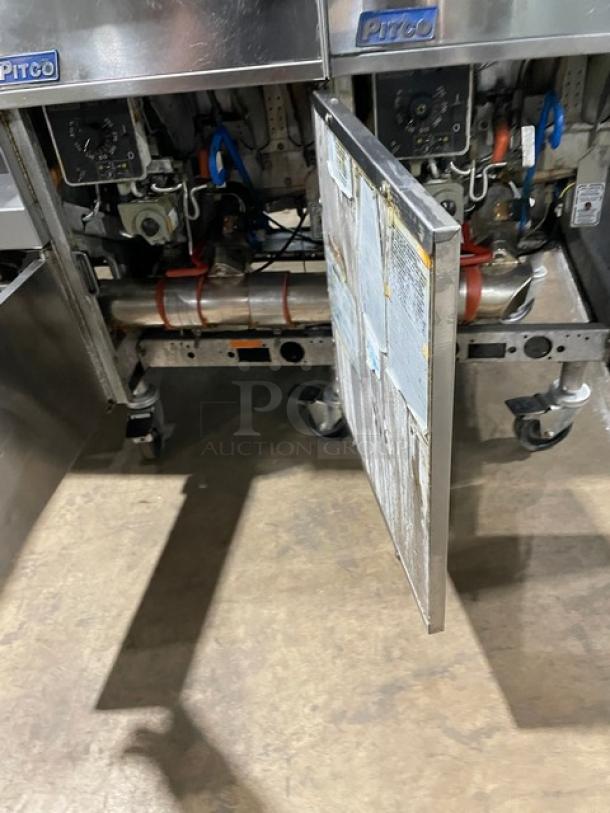 Pitco FG-SGH50 commercial stainless steel 4-bay deep fat fryer with baskets, oil filter, blue gas hose, and casters.