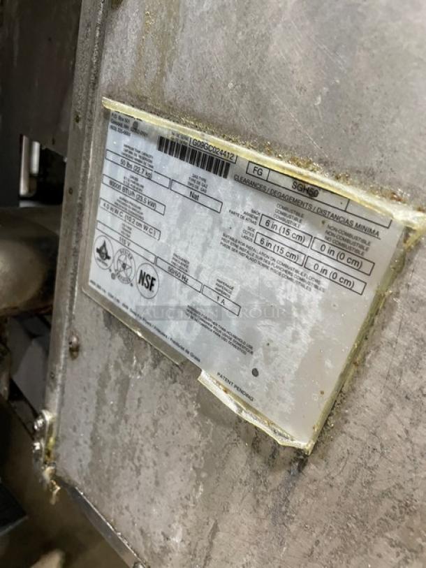 Pitco FGSGH50 commercial deep fryer system with stainless steel exterior, model and serial number visible on label.