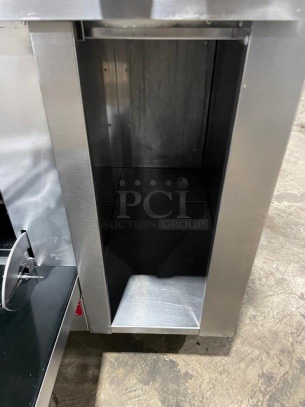 Vulcan stainless steel commercial gas 8-burner range with oven, backsplash, overhead salamander shelf, and enclosed storage.