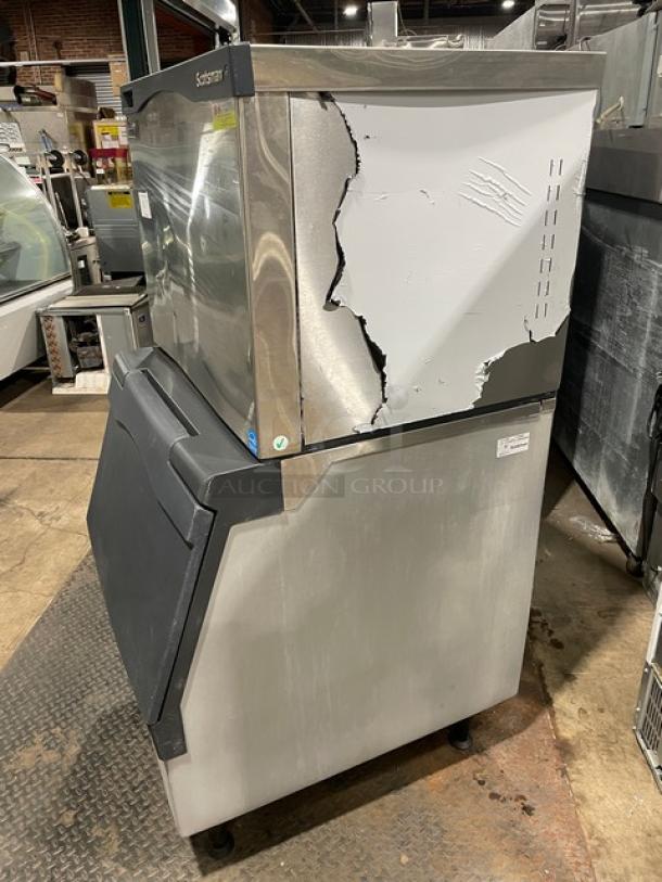 Scotsman Prodigy ice machine, model C0330SA-1C/B330P, stainless steel, damaged exterior, on legs, Energy Star certified.