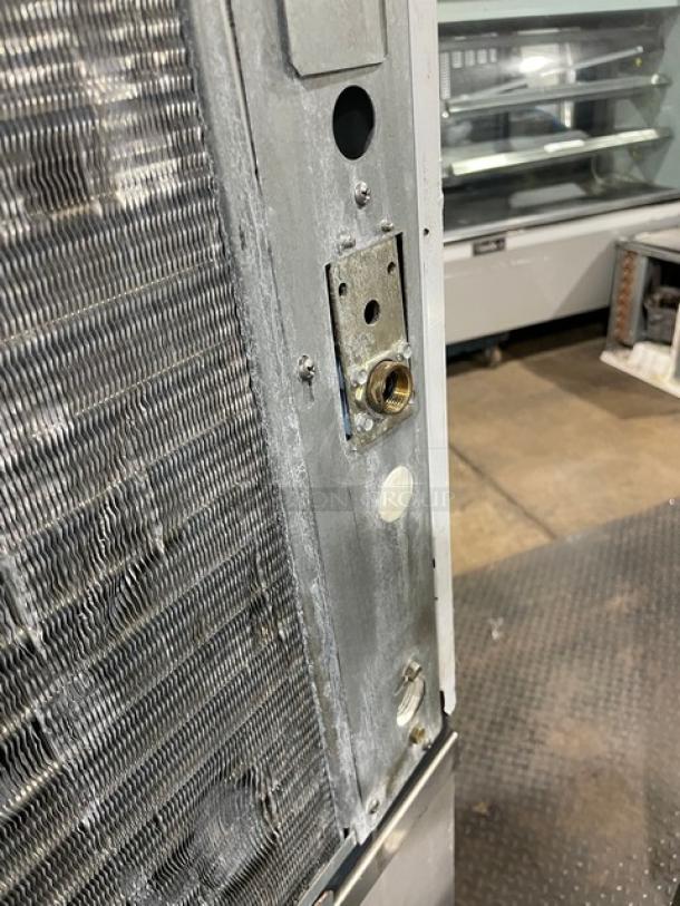 Scotsman Prodigy Series ice maker, model C0330SA-1C/B330P, stainless steel, air-cooled, shows some wear, serial numbers visible.