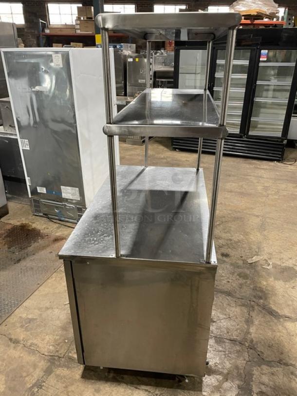 Delfield stainless steel 2-door refrigerated worktop table, model UC4048-STAR, with double overhead shelf, Energy Star certified.