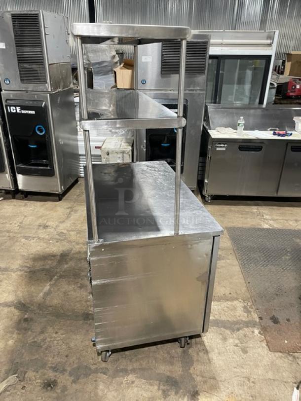 Delfield stainless steel 2-door refrigerated worktop table, Energy Star certified, double overhead shelf, poly coated wire racks, model UC4048STAR, on casters.