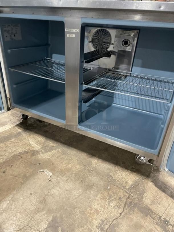 Delfield UC4048STAR stainless steel worktop table, 2-door refrigerated, Energy Star certified, with double overhead shelf, poly-coated wire racks, on casters. Model SN: 1108152002465.