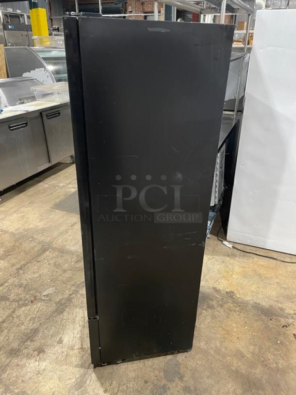 Avantco 178GDC10 commercial black single glass swing door reach-in merchandiser refrigerator with coated wire racks, 115V, on legs.