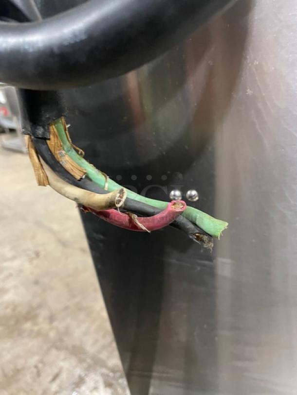 Close-up view of damaged wiring on a Southbend SX55EC stainless steel electric convection steamer.