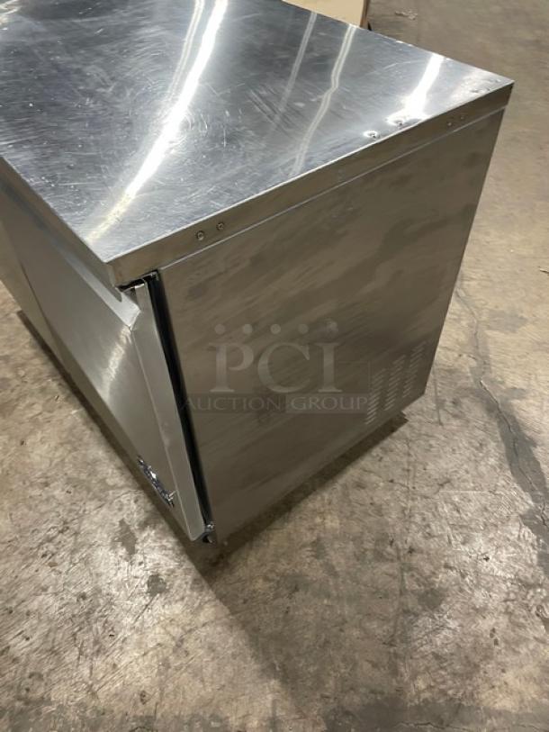 Entree UR48 stainless steel 2-door undercounter refrigerator, with poly-coated wire racks and casters, model UR48.