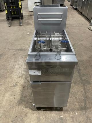 Globe GFF35G stainless steel deep fryer on casters, includes fry baskets, back splash, basket hanger, and serial number 10180137.