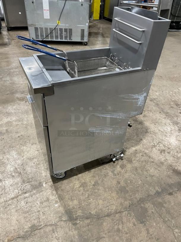 Globe Commercial Stainless Steel Natural Gas Fryer GFF35G on casters, with back splash, basket hanger, and fry baskets. Model: GFF35G SN: 10180137.