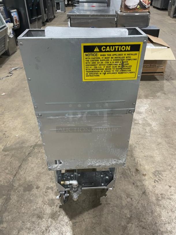 Globe GFF35G stainless steel natural gas fryer, 35-40 lb. capacity, with backsplash, basket hanger, and casters. Model: GFF35G.