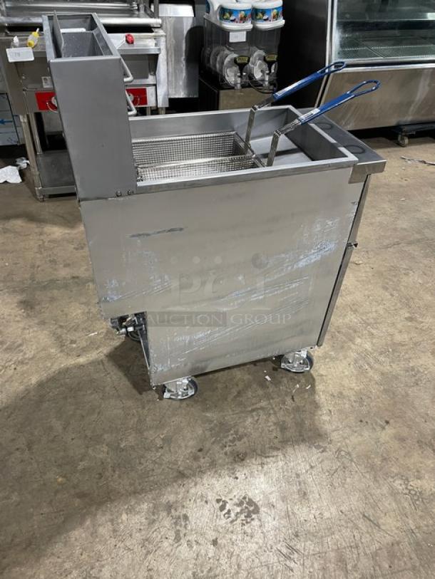 Globe GFF35G deep fat fryer, stainless steel, natural gas, with backsplash, basket hanger, fry baskets, on casters.