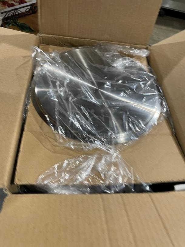 Brand new Winco Winware stainless steel double boiler with cover in open box, wrapped in plastic, ready for auction.