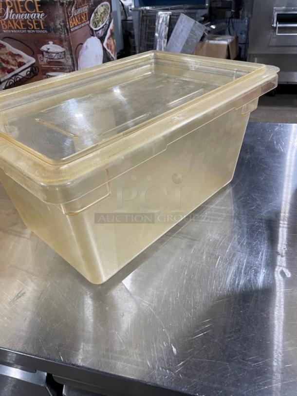 Cambro clear food storage container with lid, commercial-grade, slightly used, sturdy plastic construction, ideal for bulk storage.