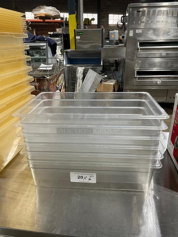 Cambro clear polycarbonate food pans stacked on a stainless steel counter. Tag indicates 20 units.