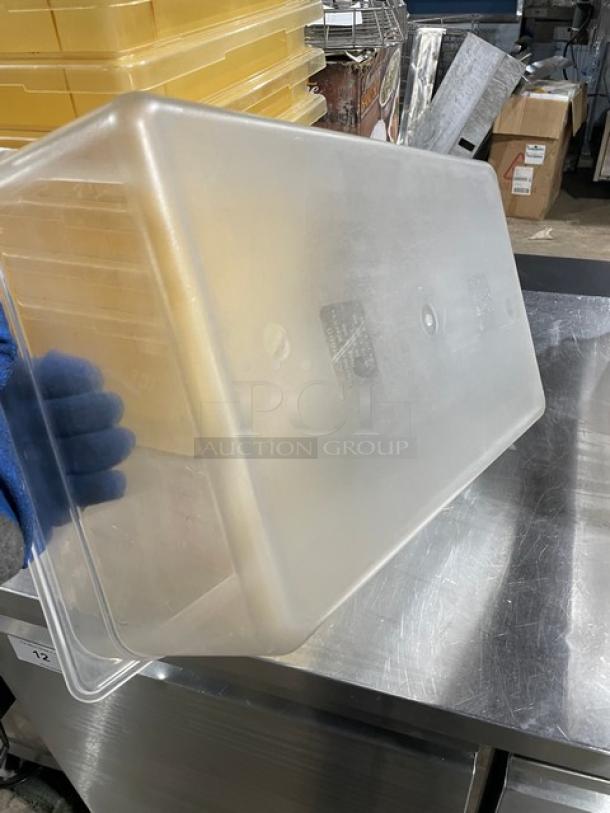 Cambro commercial clear polycarbonate food pan, used, with visible labels; durable material, versatile kitchen use.