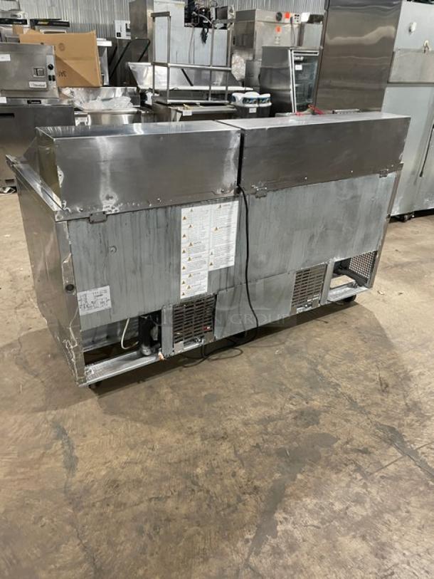 Turbo-Air MST-72-30-N stainless steel 3-door refrigerated salad/sandwich prep table, poly coated wire rack, on casters.