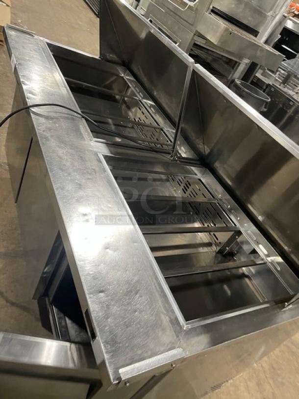Turbo-Air 3-door refrigerated prep table, model MST-72-30-N, stainless steel, poly-coated wire rack, on casters, 115V 1 phase.
