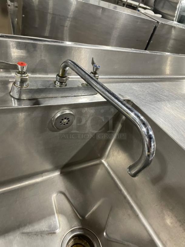 Commercial stainless steel prep table with single sink, backsplash, and swing spout faucet. Durable, ideal for kitchens.
