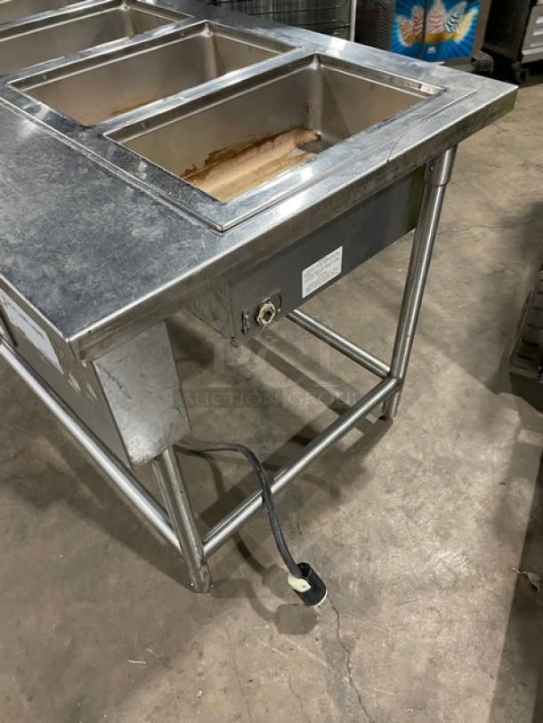 Wells MOD400TDM stainless steel 4-well hot food/steam table, electric powered, on legs, shows model label, 208/240V.