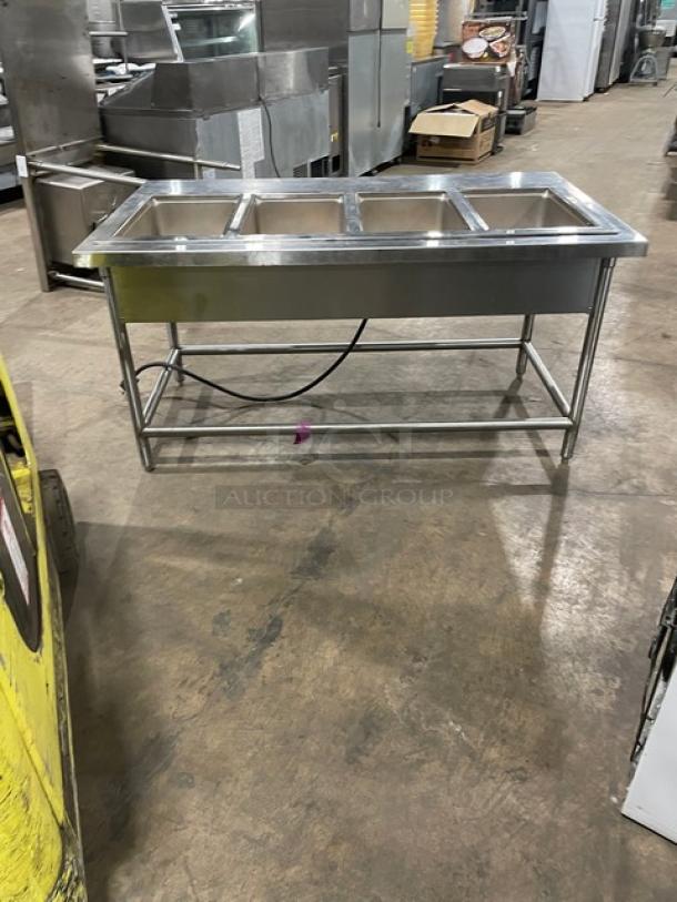 Wells MOD400TDM stainless steel 4-well steam table on legs, electric powered, 208/240V, used condition.