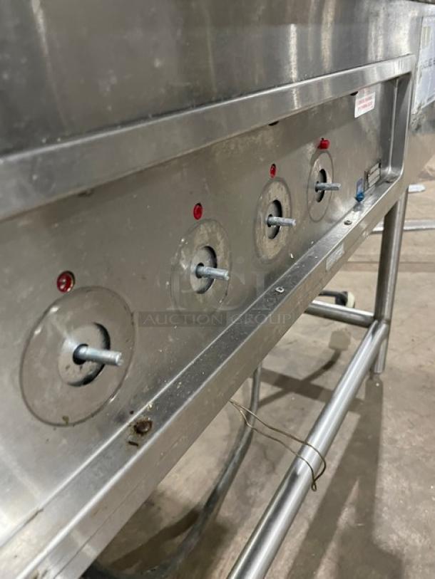 Wells MOD400TDM stainless steel 4-well hot food steamtable on legs, electric, with control knobs, 208/240V, commercial use.