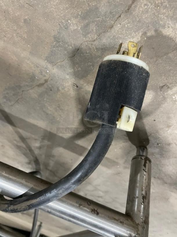 Wells MOD400TDM electric 4-well hot food table plug and power cord. Stainless steel legs, commercial use.
