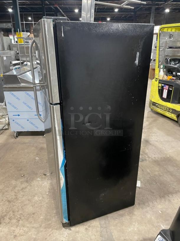 Frigidaire commercial stainless steel refrigerator/freezer, model FFTR1821QS3, with clear drawers, adjustable shelves.