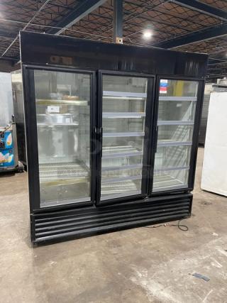 True GDM-72 commercial triple glass door refrigerator with poly coated wire racks, 115V, used condition.