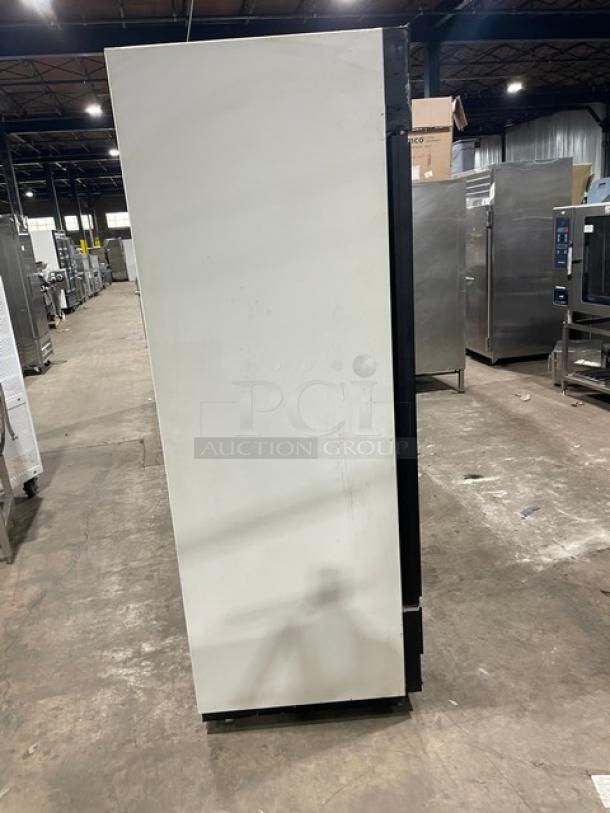 True GDM-72 commercial refrigerator, side view. Triple glass doors, poly coated wire racks, white exterior, 115V, 1 phase.