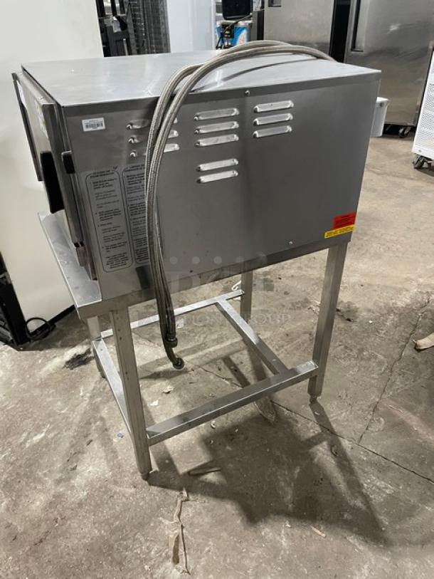 Groen HY-3E electric countertop stainless steel convection steamer, 3-pan capacity, on open base stand, 208V, 3-phase.